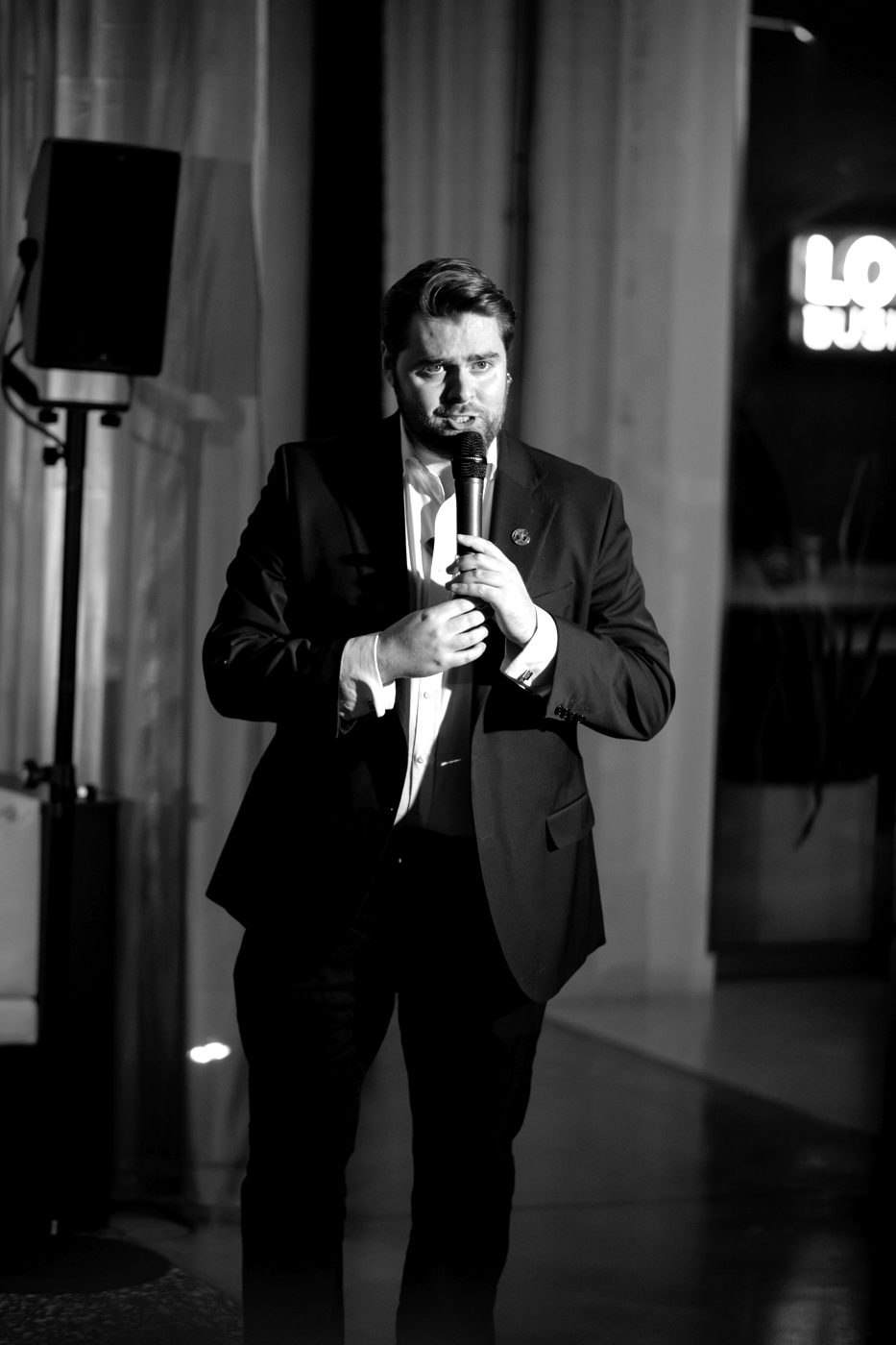 Rhys Morris, event host and MC, on stage