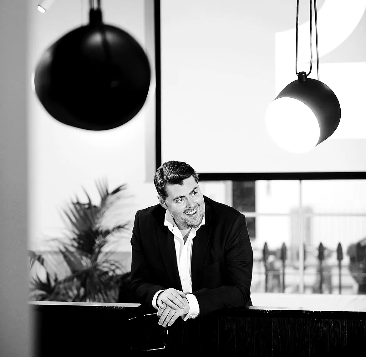 Portrait of Rhys Morris, event host and MC, in London