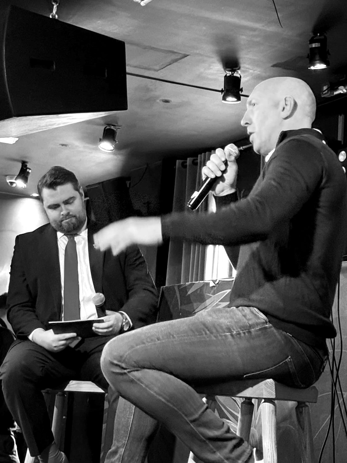 Rhys Morris interviewing a guest on stage