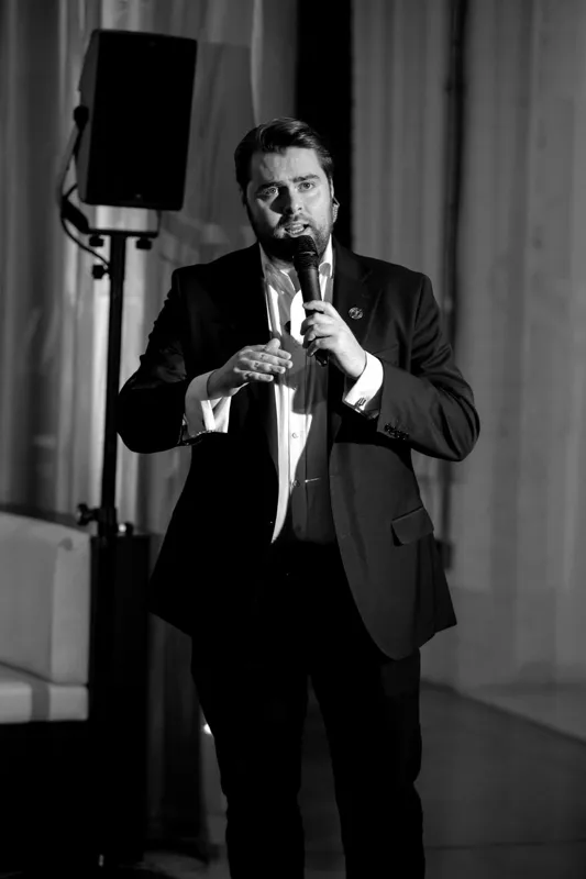 Rhys Morris: on stage, full length, black and white